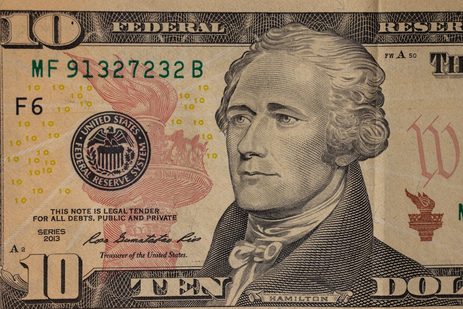 An ordinary Series 2013 U.S. ten-dollar bill showing Alexander Hamilton